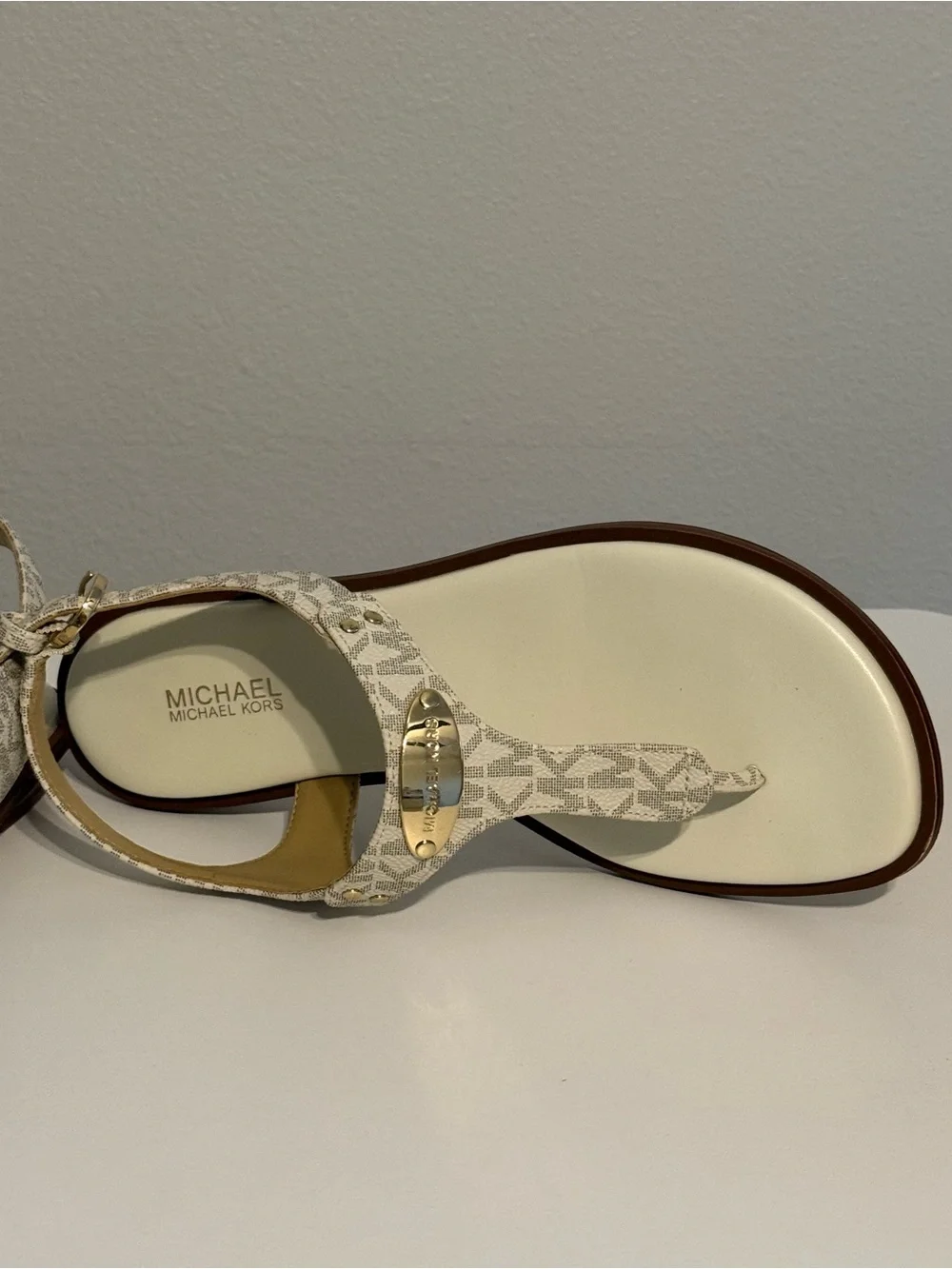 Michael Kors Cream/White Logo T-Strap Sandals with Gold Plaque